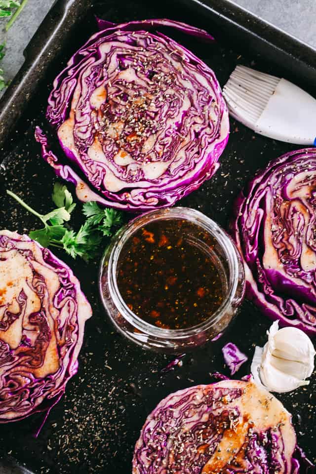 Balsamic brushed red Cabbage Steaks arranged on a sheet pan.