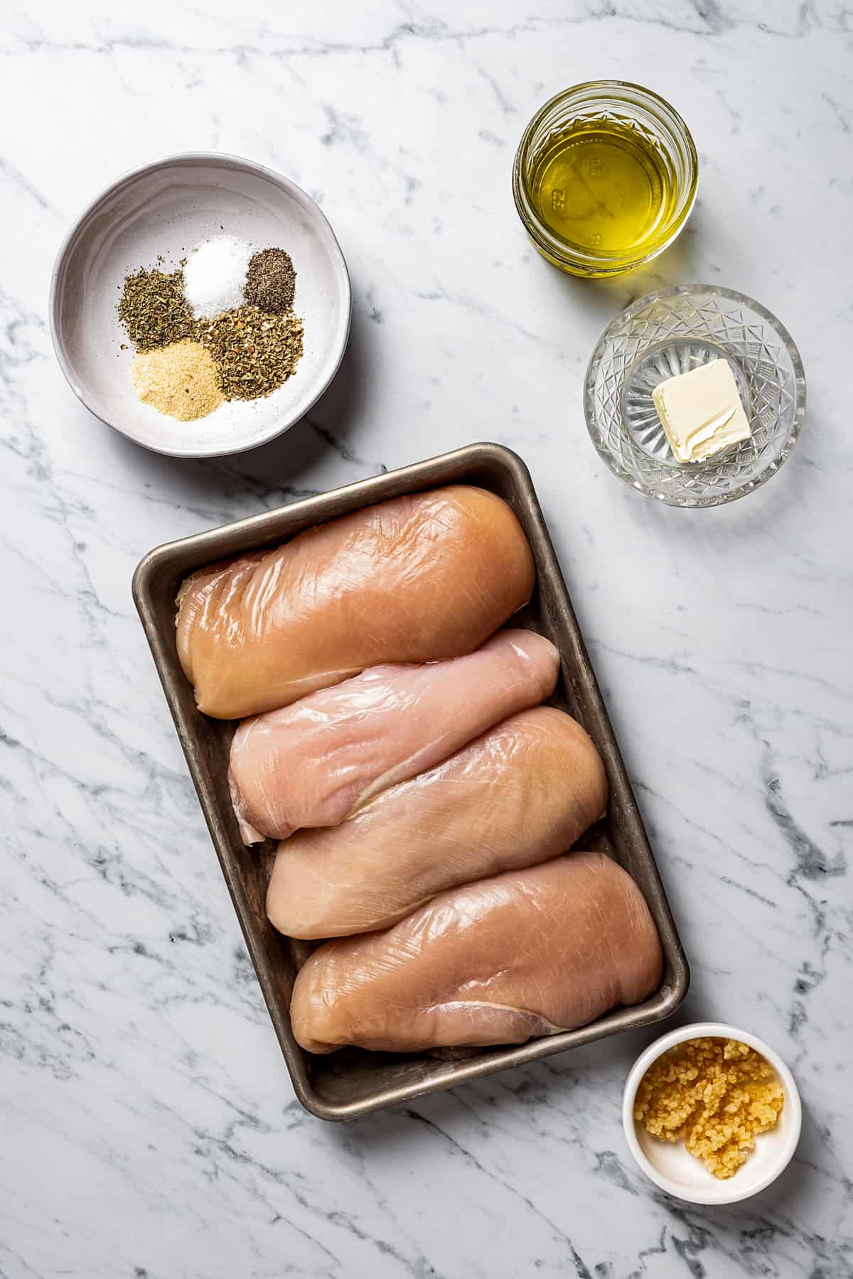 Overhead view of ingredients for baked chicken breasts