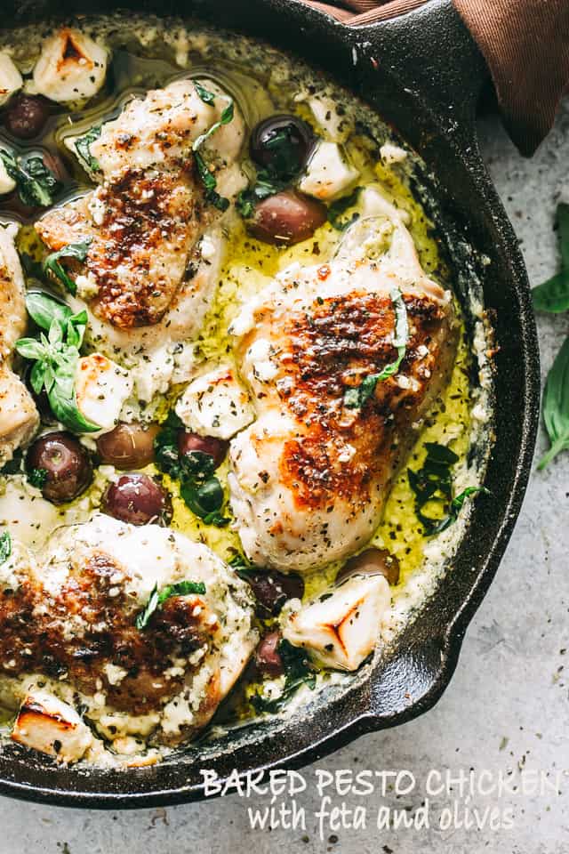 Baked chicken thighs in a feta sauce with basil pesto and olives.