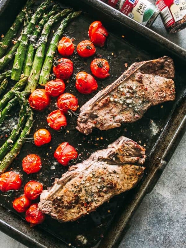 Steak and vegetables on a sheet pan.