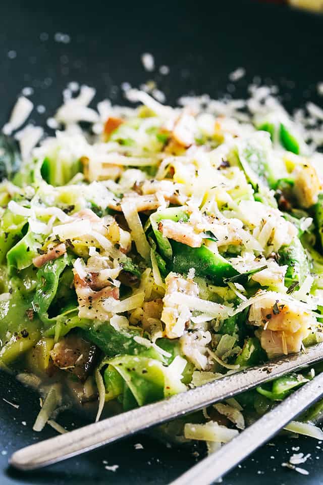 Close-up shot of zucchini noodles in carbonara sauce.