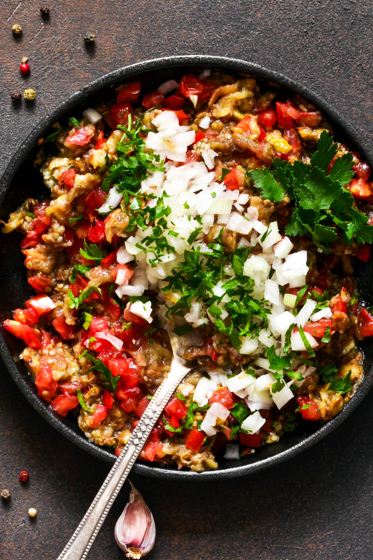 Instant pot burrito bowl served in a bowl and topped with diced onions and fresh cilantro.