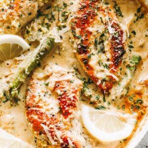 One Skillet Creamy Lemon Chicken with Asparagus - Delicious, bright, and simple, this lemon chicken recipe is the perfect easy weeknight meal made entirely in just one skillet and in under 30 minutes. The creamy sauce with the seared chicken and asparagus is a mouthwatering combination that everyone loves!