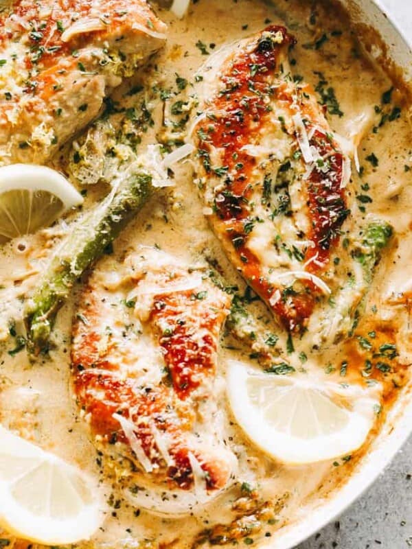 One Skillet Creamy Lemon Chicken with Asparagus - Delicious, bright, and simple, this lemon chicken recipe is the perfect easy weeknight meal made entirely in just one skillet and in under 30 minutes. The creamy sauce with the seared chicken and asparagus is a mouthwatering combination that everyone loves!
