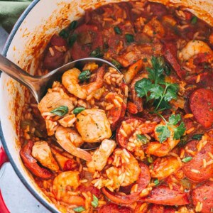 Jambalaya Recipe - Easy, tasty, one pot recipe for Jambalaya prepared with rice, chicken, shrimp, and sausages. Whip up this Southern favorite in just 30 minutes and get ready for a Mardi Gras dinner that the whole family will love! 