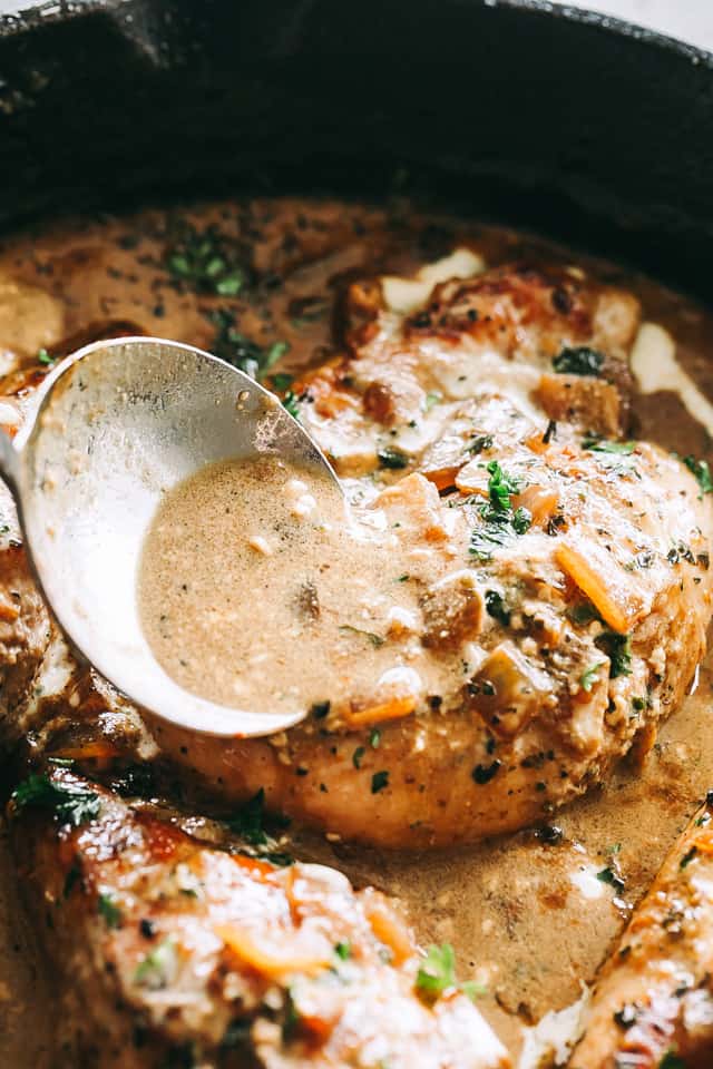 Skillet Chicken in White Wine Sauce - Quick and easy skillet seared chicken topped with a delicious garlic and onions white wine sauce that's sure to please any crowd!
