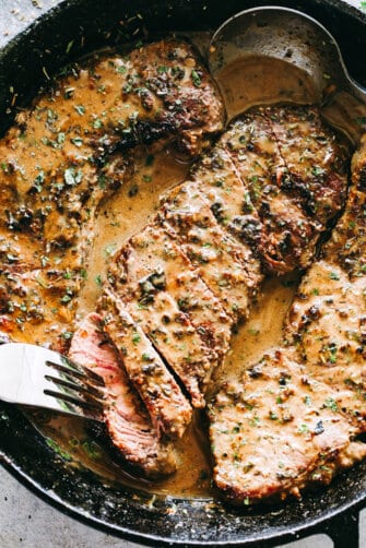 Skillet Bourbon Steak Recipe - Pan seared juicy sirloin steaks prepared with a dijon mustard rub and an incredible creamy bourbon sauce. A one pan recipe that is SO simple and SO darn delicious!