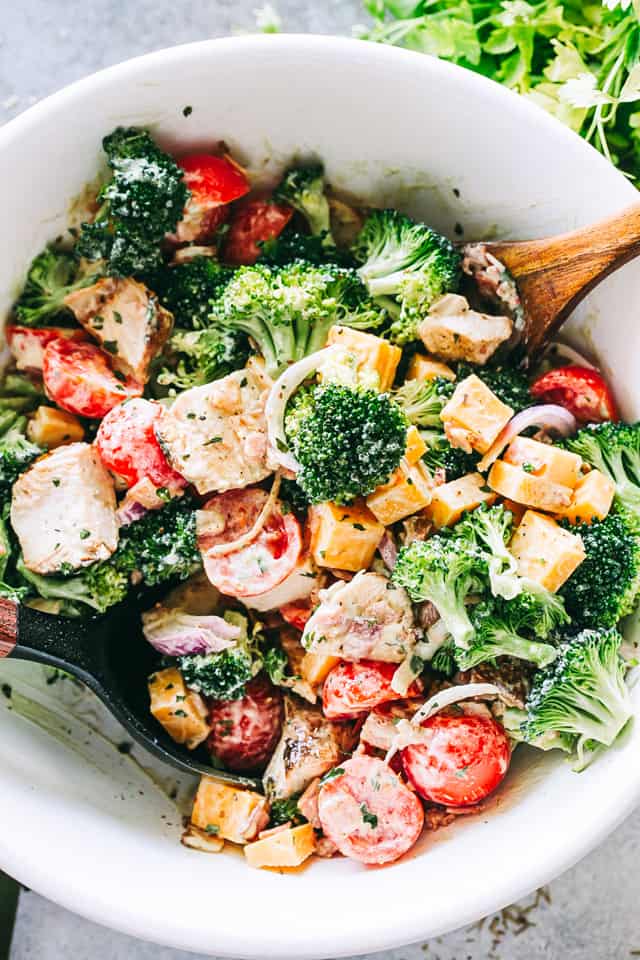 Creamy Broccoli Salad served in a white salad bowl. 