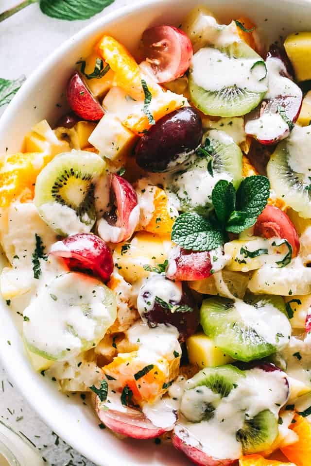 Close-up shot of Fruit Salad with grapes, kiwi, oranges, and pineapple.