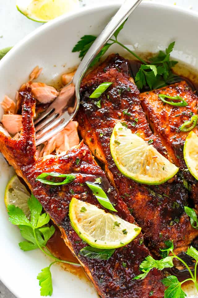 Three Glazed Salmon fillets on a serving plate.