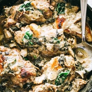 Spinach Artichoke Chicken Recipe - Easy, delicious, and rich skillet dinner prepared with seared chicken breasts, fresh spinach, flavorful artichokes, and an amazing creamy cheese sauce. Quick and easy enough for a weeknight meal, but also great for a special dinner party. 