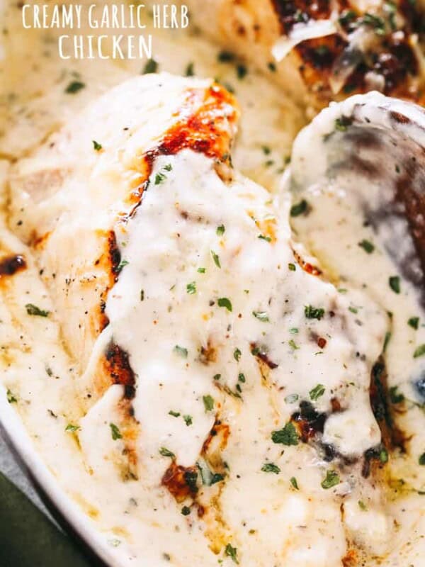 Creamy Garlic Herb Chicken Recipe - Pan-seared chicken breasts prepared with a creamy, garlicky herb sauce. Flavorful, quick weeknight dinner prepared in one pan and in 30 minutes!