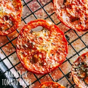 Parmesan Tomato Chips Recipe - Turn ordinary tomatoes into sweet, crispy tomato chips bursting with delicious flavors. No fryer or dehydrator necessary for these cheesy tomato chips!