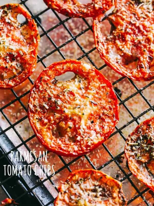 Parmesan Tomato Chips Recipe - Turn ordinary tomatoes into sweet, crispy tomato chips bursting with delicious flavors. No fryer or dehydrator necessary for these cheesy tomato chips!