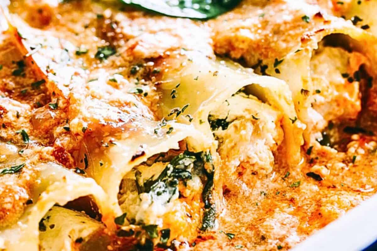 Tender cannelloni tubes are stuffed with cheesy chicken, ricotta, and spinach, then baked in creamy sauce in this easy family dinner recipe! Stuffed and baked cannelloni, and topped with a creamy cheese mixture.