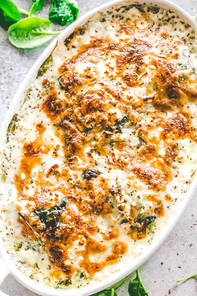 Cheesy Chicken Spinach Bake in an oval baking dish.