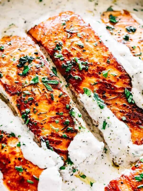 Pan Seared Salmon with Lemon Garlic Cream Sauce - Quick, delicious, bright and creamy salmon dinner prepared in just one skillet and served with an incredible lemon garlic cream sauce! All you need is about 20 minutes and a handful of ingredients.