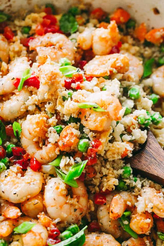 Shrimp Fried Cauliflower Rice - Skip the takeout and make this amazing, low carb "fried rice" meal right at home in just 20 minutes! 