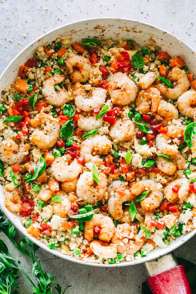 Shrimp Fried Cauliflower Rice - Skip the takeout and make this amazing, low carb "fried rice" meal right at home in just 20 minutes! 