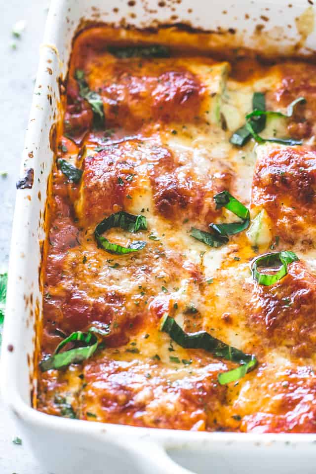 Zucchini Lasagna Roll Ups - Zucchini slices rolled up around a delicious ricotta filling, baked in tomato sauce and topped with cheese. A healthier, low carb option that's not only delicious, but also very easy and quick to make.