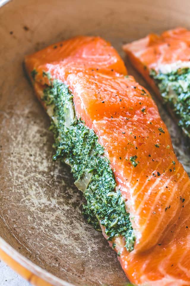 Stuffed Salmon with Spinach and Artichoke Dip - Easy and quick to make, absolutely incredible pan-seared salmon fillets stuffed with a deliciously creamy spinach and artichoke dip.