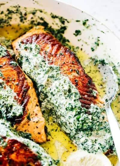 Stuffed Salmon with Spinach and Artichoke Dip - Easy and quick to make, absolutely incredible pan-seared salmon fillets stuffed with a deliciously creamy spinach and artichoke dip.