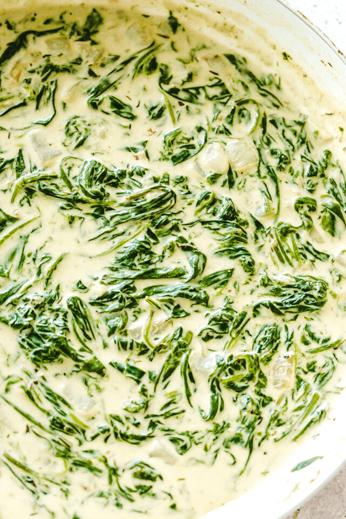 overhead shot of spinach in cream