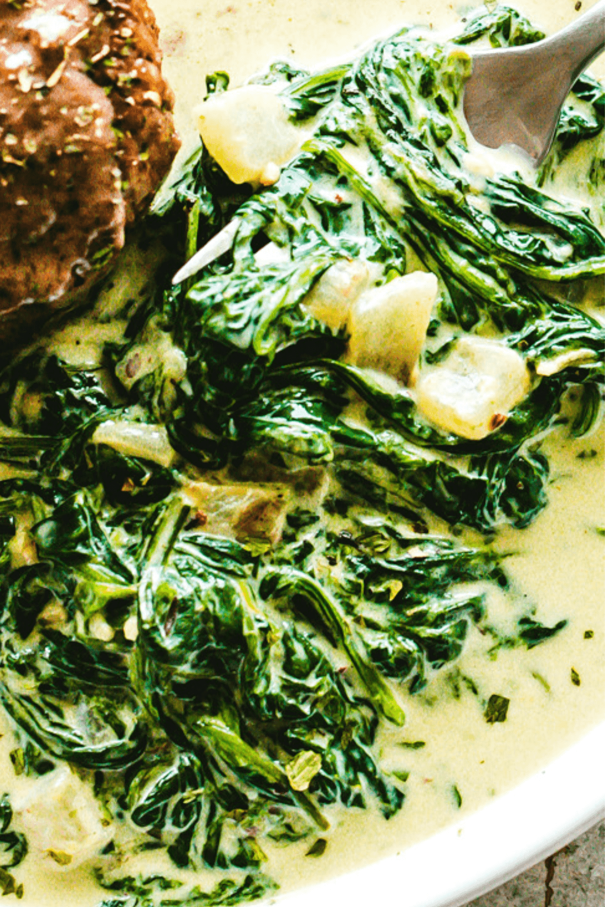 spinach and onions set over a melty creamy cheese mixture.