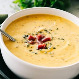 Cauliflower Cheese Soup - A wonderful twist on the classic cheese soup prepared with cauliflower, bacon, cheddar cheese, and a splash of cream. This soup will have everyone coming back for seconds! 
