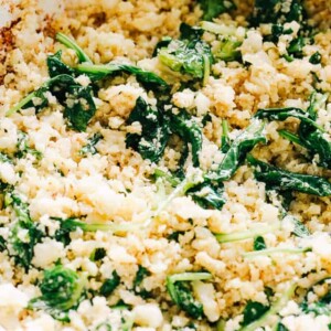 Garlic Butter Cauliflower Rice with Spinach - Easy, crunchy, incredibly flavorful Garlic Butter Cauliflower Rice is simple, healthy, and so surprisingly GOOD! 