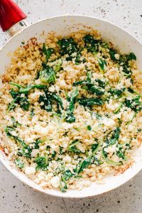 Garlic Butter Cauliflower Rice with Spinach - Easy, crunchy, incredibly flavorful Garlic Butter Cauliflower Rice is simple, healthy, and so surprisingly GOOD! 