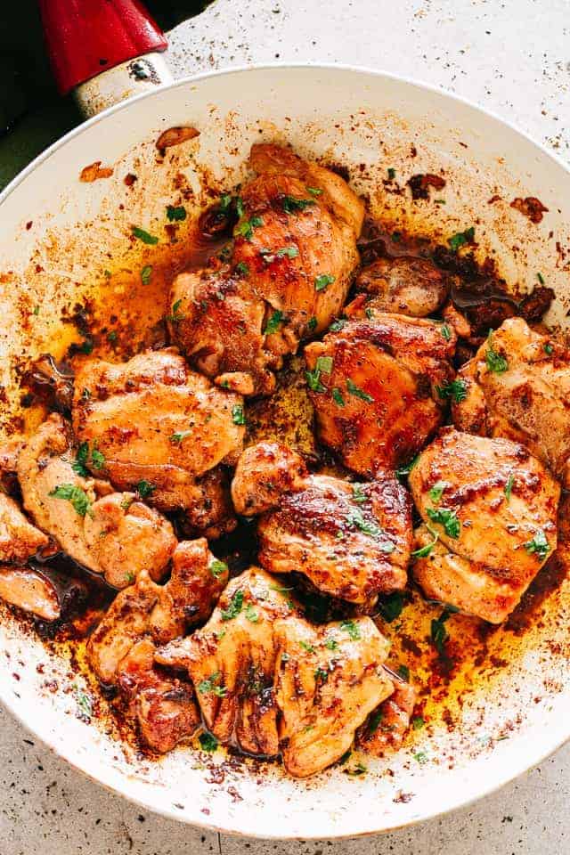 Juicy Stove Top Chicken Thighs - Perfectly golden, tender, and juicy skinless and boneless chicken thighs prepared on the stove top. These delicious pan seared chicken thighs make for a wonderful meal that's surprisingly easy, and the pan sauce is amazing!