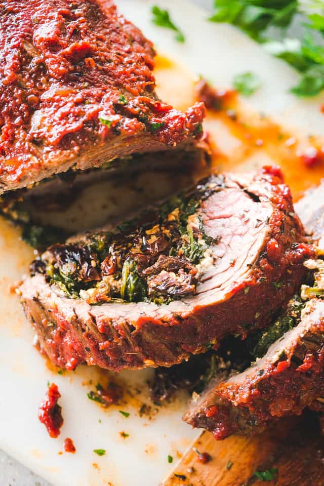 Close up of stuffed flank steak sliced into rounds.