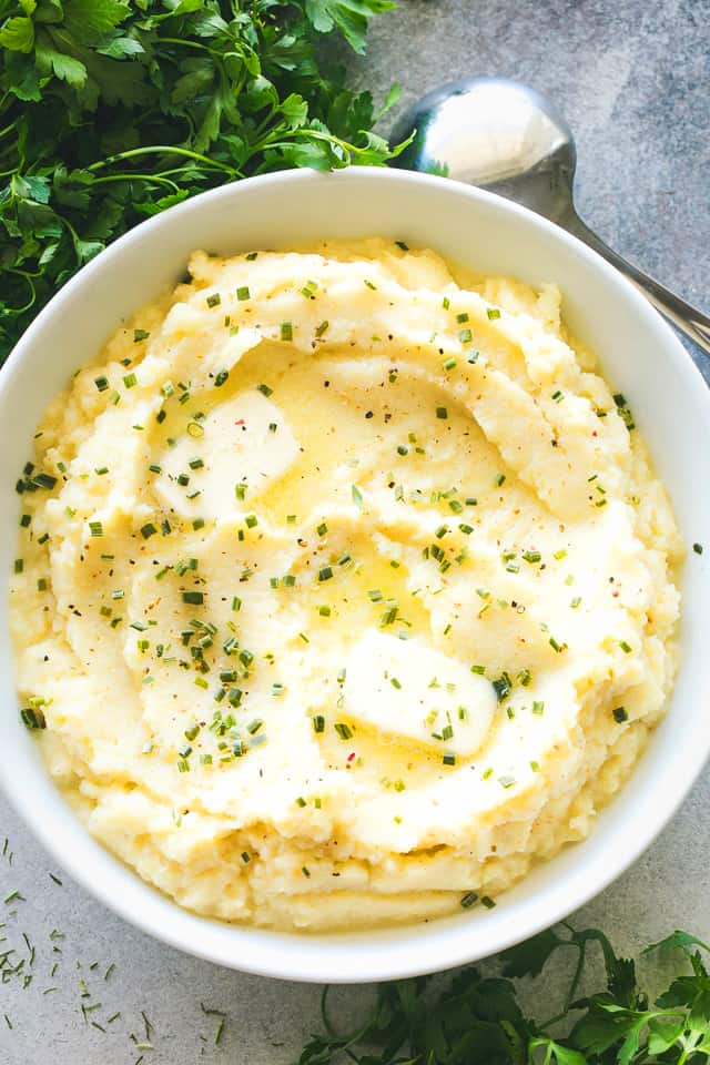 Instant Pot Mashed Cauliflower with Garlic and Chives - Creamy, buttery mashed cauliflower combined with plenty of garlic and chives makes for one super flavorful side dish! Mashed cauliflower is the perfect low carb alternative to mashed potatoes, and made in a fraction of the time, thanks to our Instant Pot. 