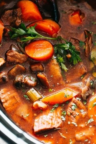 Hearty slow cooker beef stew with tender veggies and freshly parsley.