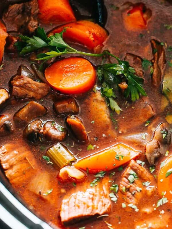 Hearty slow cooker beef stew with tender veggies and freshly parsley.