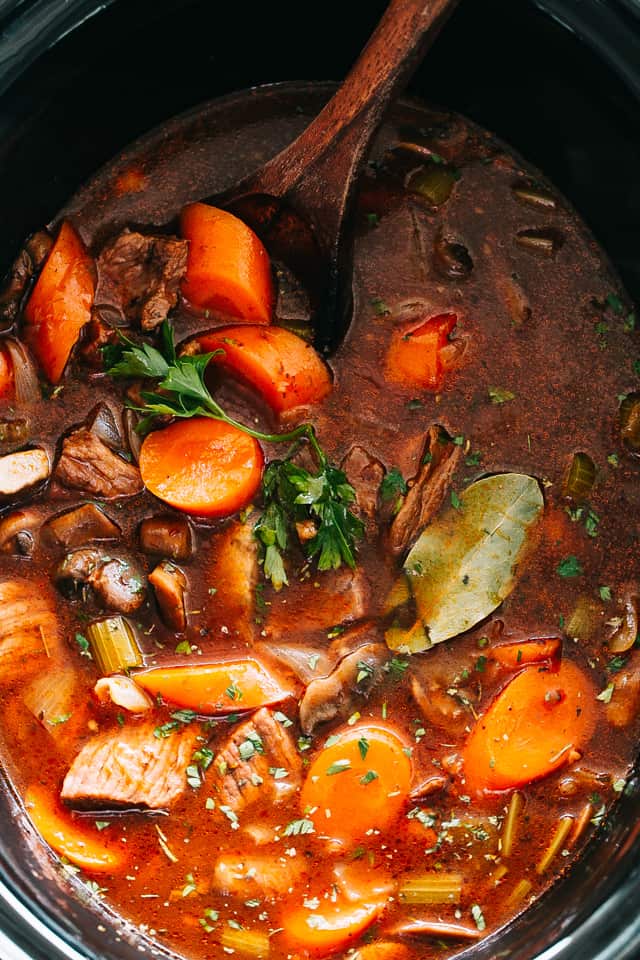 Slow Cooker Beef Stew - Rich and hearty stew packed with melt in your mouth beef chunks and veggies, and slow cooked to a crazy delicious and tender perfection. This is a recipe that you'll go back to again and again. 