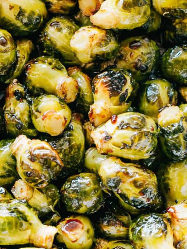 Close up view of oven roasted Brussels sprouts tossed in honey balsamic glaze.