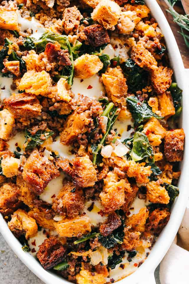 Closeup overhead image of sausage stuffing in a casserole dish.