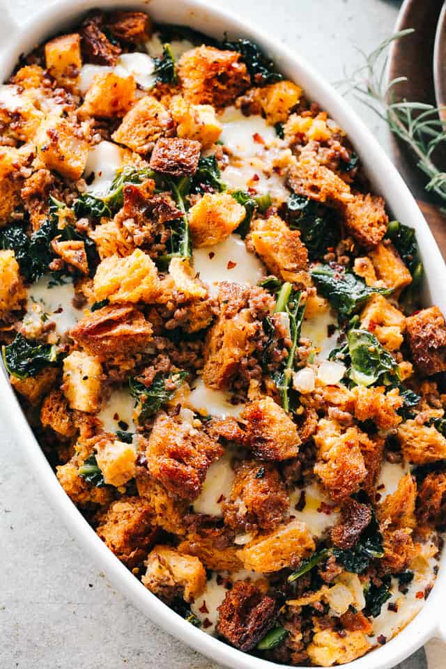 Overhead image of cheesy sausage stuffing in a casserole dish.