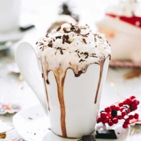 Crock pot hot chocolate in a mug with whipped cream.