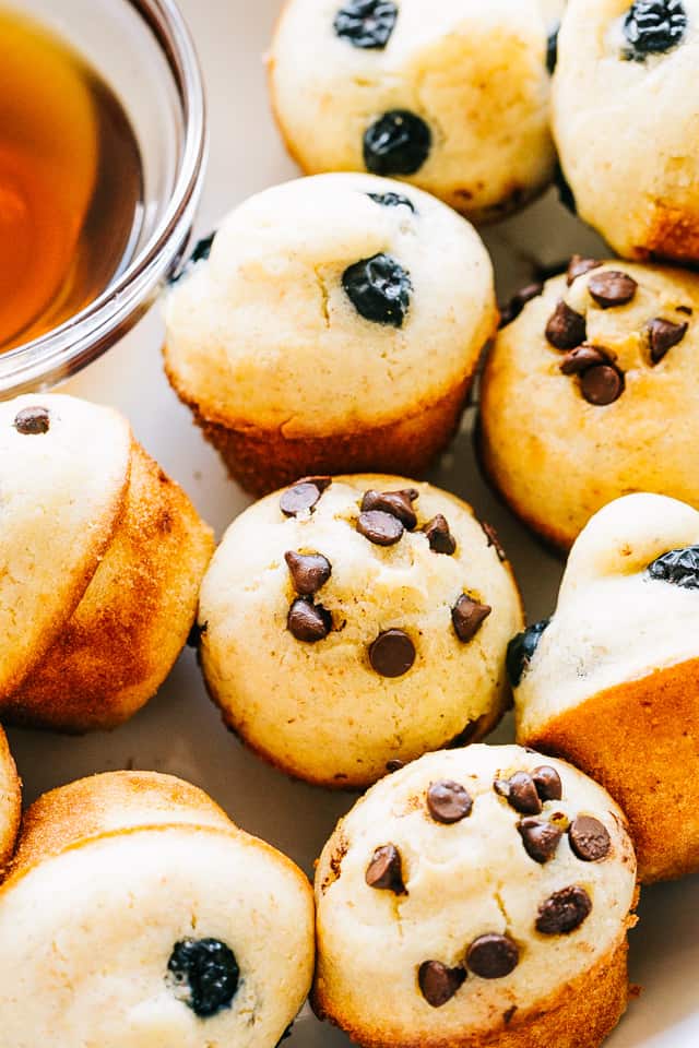 Pancake muffin bites topped with chocolate chips and blueberries.