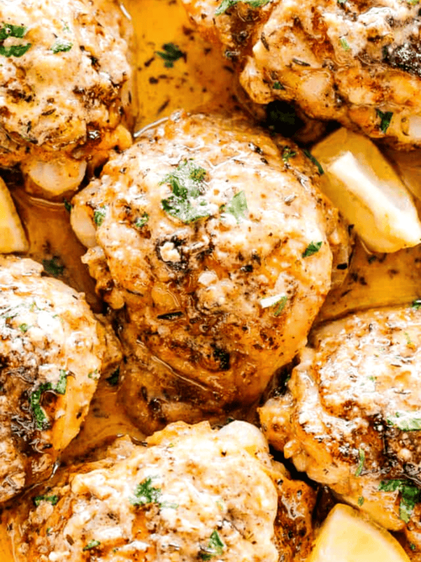 close up shot of chicken thighs cooked in the instant pot with lemon butter sauce.