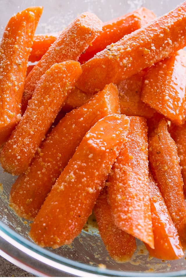 Raw Carrots tossed with butter and grated parmesan cheese.