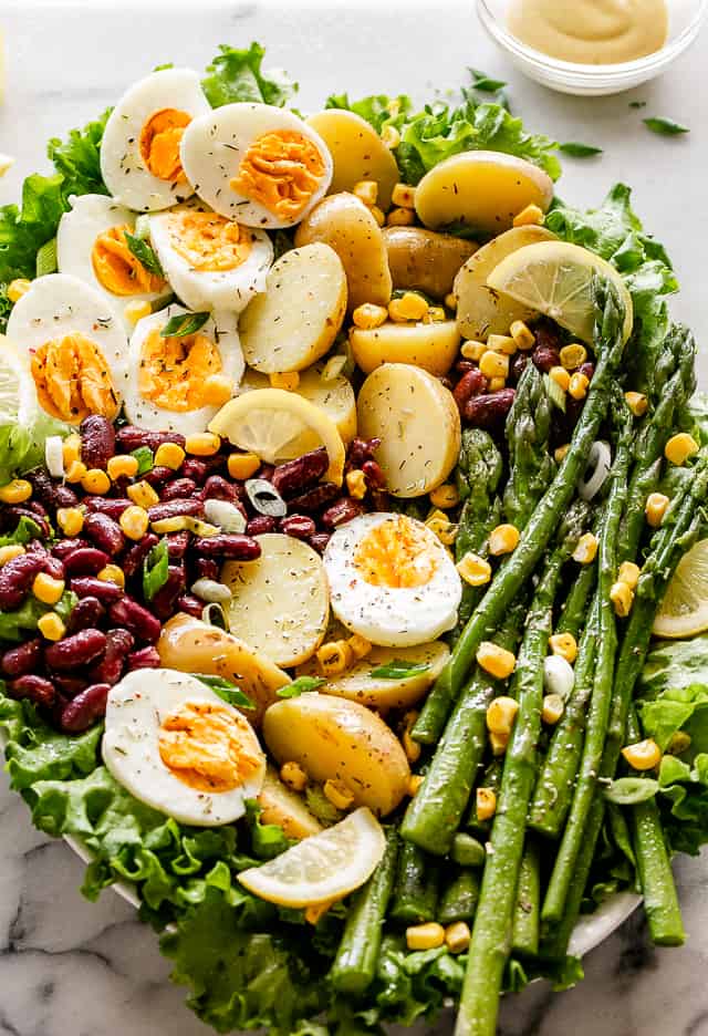 Spring salad with eggs, asparagus, potatoes, and beans. 