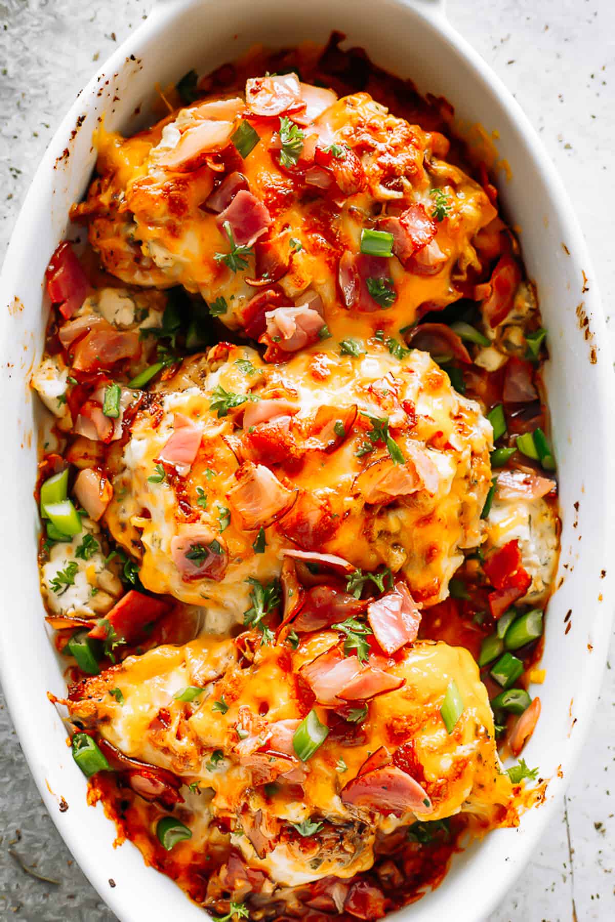 Baked Crack Chicken Breasts arranged in a white baking dish.