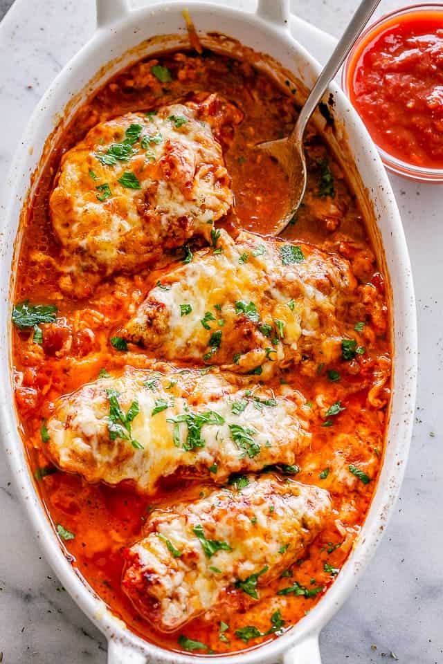 Baked Chicken breasts in baking dish with salsa.