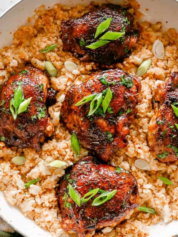 Cajun Chicken Thighs served over cauliflower rice.