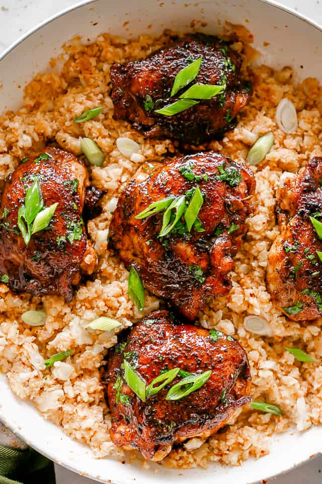 Cajun Chicken Thighs served over cauliflower rice.