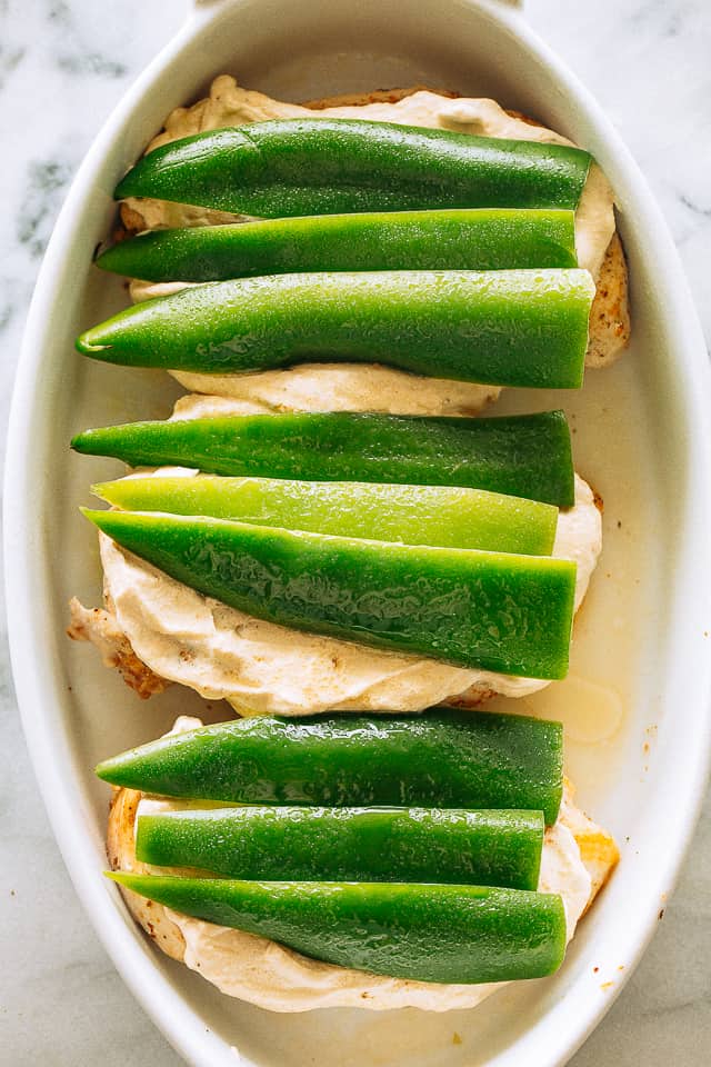 Chicken and cream cheese topped with jalapeno peppers.